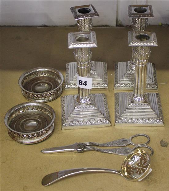 Plated wares to include- a set of four Egyptian column candlesticks, pair of coasters etc